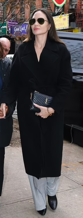 Who made Angelina Jolie's black belted coat and leather handbag